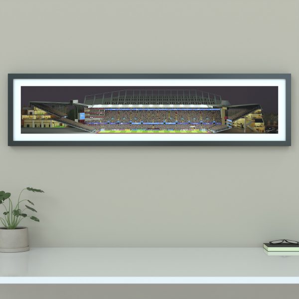 A panoramic print of Villa Park on a Champions League night, packed with fans as Aston Villa faces Bayern under bright floodlights.