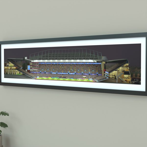 A panoramic print of Villa Park on a Champions League night, packed with fans as Aston Villa faces Bayern under bright floodlights.